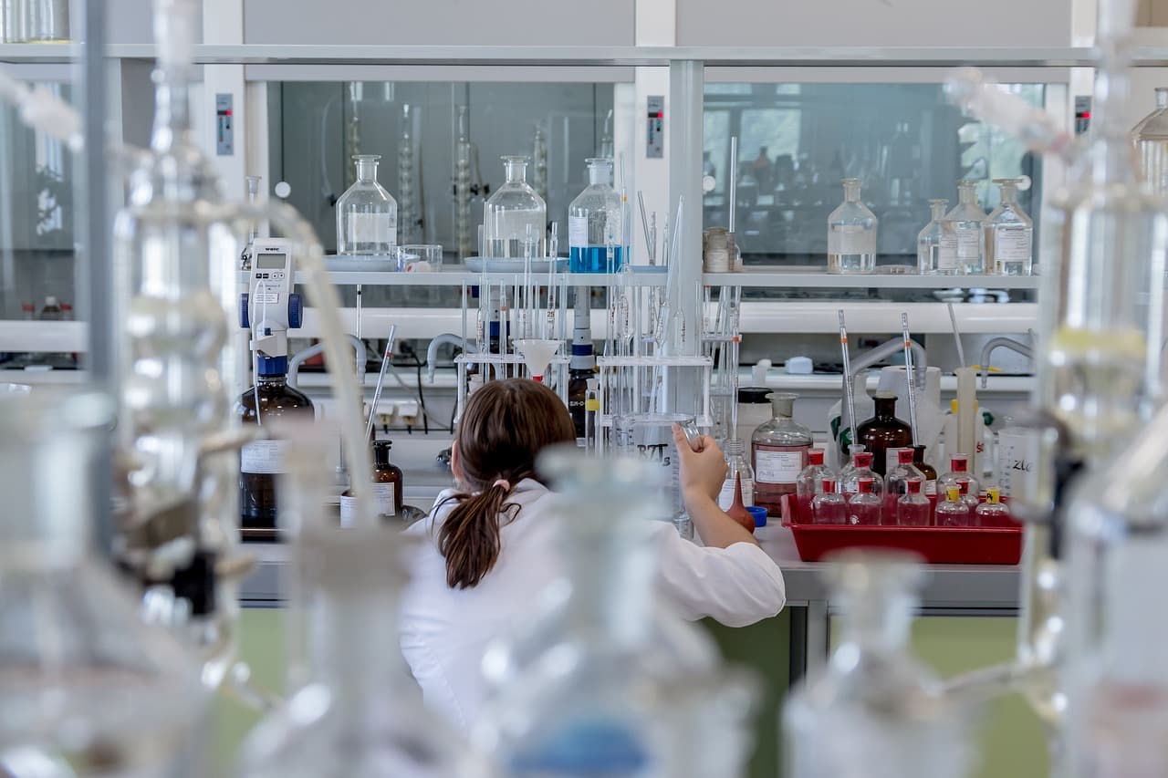 Laboratory technician working with glassware