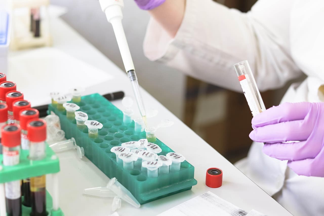 Researcher labeling test tube samples in a laboratory